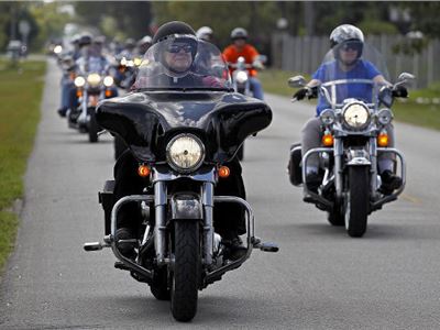 Archbishop Thomas Wenski, Miami - Florida, rode from church to church on his Harley Davidson 