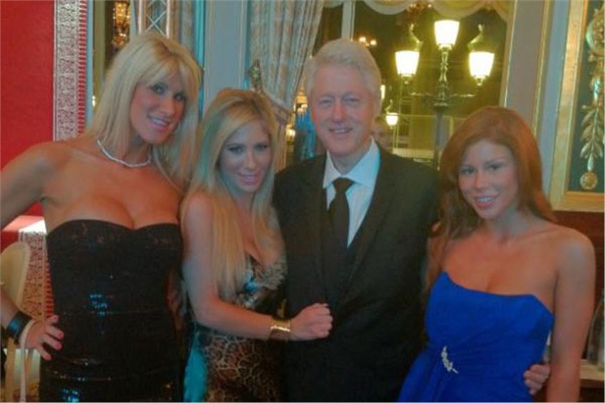 Bill Clinton photographed posing next  two porn stars