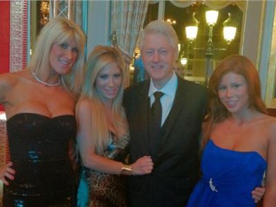 Bill Clinton photographed posing next  two porn stars