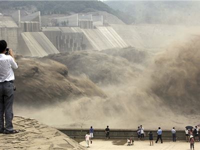 China's giant man-made waterfall as floodgates are opened to send millions of tons of silt downstream.