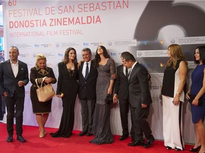 Lovely in lace: Monica Bellucci shows off her  curves at the red carpet in San Sebastian. 