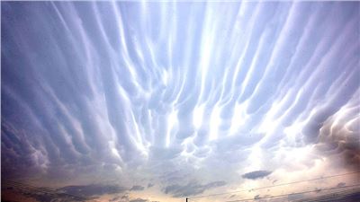 Ripples in the heavens: Glowing 'fingers' appear across a Texan sky as storms sweep the area