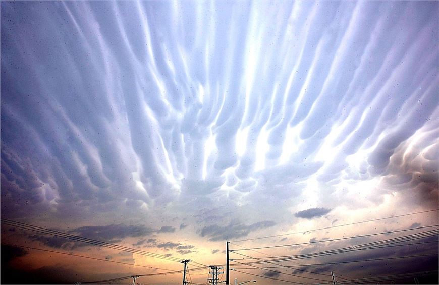 Ripples in the heavens: Glowing 'fingers' appear across a Texan sky as storms sweep the area