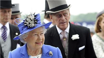 The Queen makes first appearance of her Diamond Jubilee weekend celebrations at Epsom Racecourse in Royal blue in front of 130,000 spectators