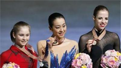 Three beautiful female athletes on the podium at the World Championships  in Japan.