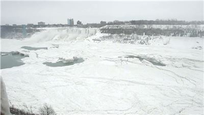 Water still cascades over nearly frozen Niagara Falls